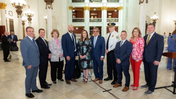 Sen. Lisa Baker (center) with Detective Kyle Gilmartin to her left, along with legislative and public safety officials following today’s press conference.