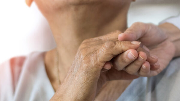 Senior citizens holding hands