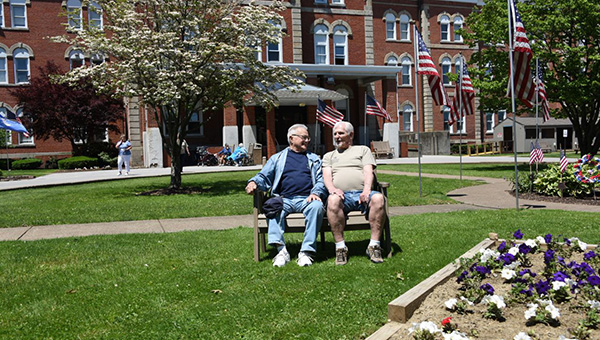 Two men sitting outside of PA Veterans Home in Erie