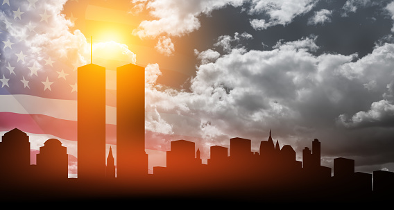 New York skyline silhouette with Twin Towers and USA flag at sunset. 09.11.2001 American Patriot Day banner.