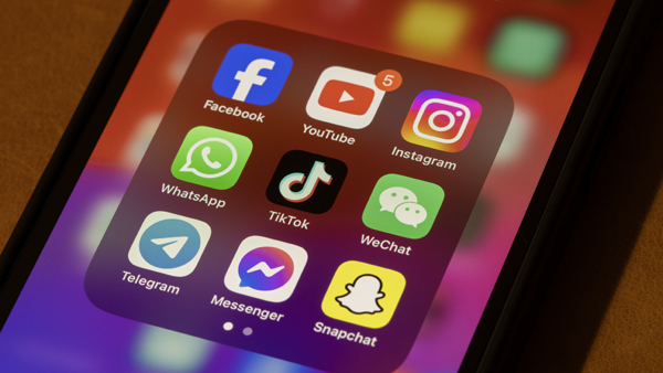 Cell phone screen featuring buttons for Facebook, YouTube, Instagram and more apps
