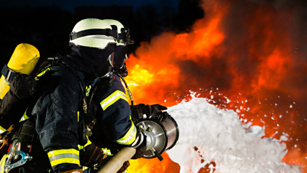 firefighter using firefighting foam