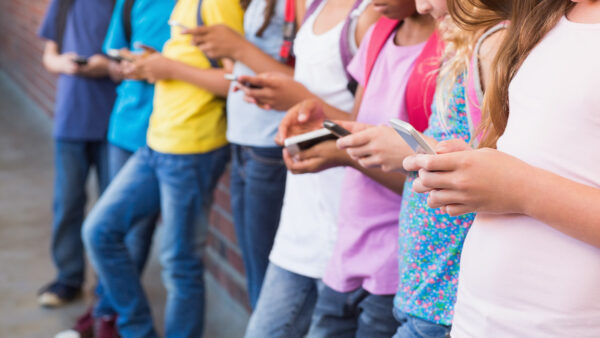 Children looking at their phones
